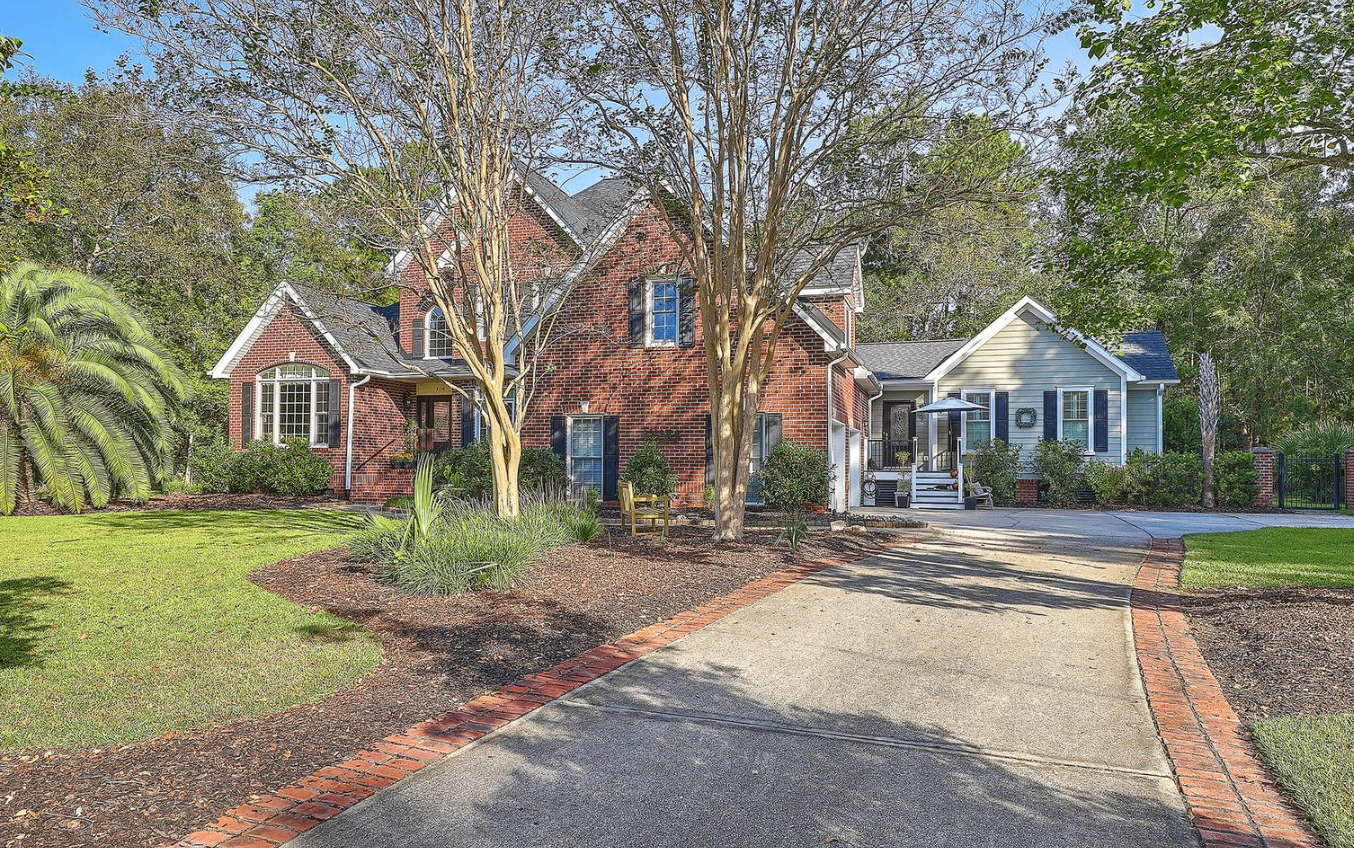 Brick traditional home with brick-lined driveway at 2118 Shell Ring Circle